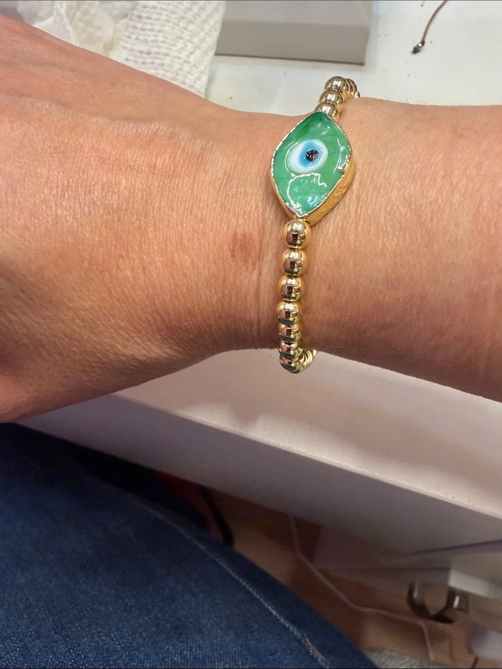 Gold Beaded Bracelet with Green Evil Eye Charm
